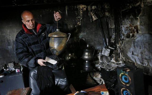 Damage at the office of Beitar Jerusalem soccer club which was set on fire when by a Molotov cocktail was thrown into his office early this morning. February 08, 2013. (photo credit: Miriam Alster/FLASH90) Damage at the office of Beitar Jerusalem soccer club which was set on fire when by a Molotov cocktail was thrown into his office early this morning. February 08, 2013. (photo credit: Miriam Alster/FLASH90)