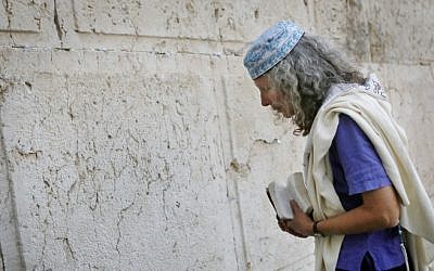 A woman prays at Robinson's Arch, near the Western Wall in Jerusalem, March 12, 2013. (photo credit: Miriam Alster/FLASH90)