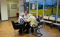 Illustrative photo of elderly men playing backgammon at a country club in northern Tel Aviv. (Tomer Neuberg/Flash90)