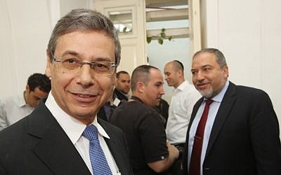 Former deputy foreign minister Danny Ayalon (L) at the Jerusalem Magistrates Court in Jerusalem next to his former boss, Avigdor Liberman, Thursday, May 2, 2013 (photo credit: Yossi Zamir/POOL/Flash90)