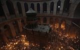 Orthodox Christian worshipers celebrate Easter at the Church of the Holy Sepulchre in Jerusalem's Old City during on May 4, 2013. (photo credit: Sliman Khader/Flash90).