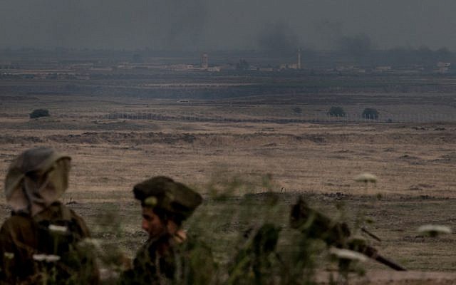 Israeli infantry soldiers on the Golan Heights, near the Syrian border, on the day after an early May strike in Damascus (Photo credit: Flash 90) Israeli infantry soldiers on the Golan Heights, near the Syrian border, on the day after an early May strike in Damascus (Photo credit: Flash 90)
