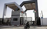 Hamas security forces stand guard at the closed gate of the Rafah crossing with Egypt in the southern Gaza Strip in May, 2013. (photo credit: Abed Rahim Khatib/Flash90)