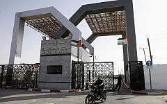 Hamas security forces stand guard at the closed gate of the Rafah crossing with Egypt in the southern Gaza Strip in May, 2013. (photo credit: Abed Rahim Khatib/Flash90)