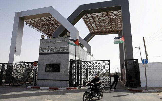 Hamas security forces stand guard at the closed gate of the Rafah crossing with Egypt in the southern Gaza Strip on Friday. (photo credit: Abed Rahim Khatib/Flash90)