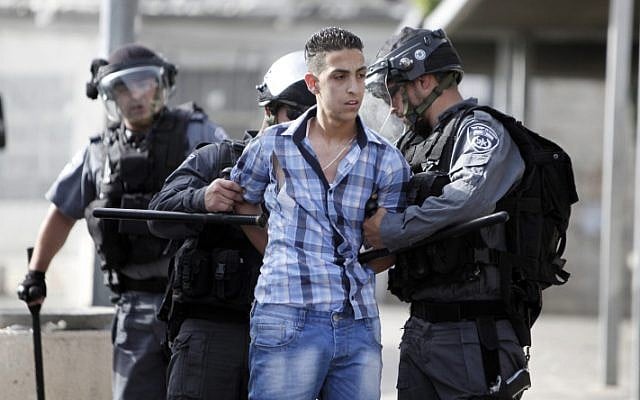 Illustrative photo of Israeli policemen detaining a Palestinian youth during a protest in Damascus Gate, Jerusalem in May 2013. (photo credit: Sliman Khader/Flash90) Illustrative photo of Israeli policemen detaining a Palestinian youth during a protest in Damascus Gate, Jerusalem in May 2013. (photo credit: Sliman Khader/Flash90)