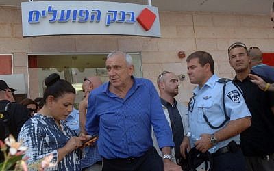 Minister of Public Security Yitzhak Aharonovitch speaks to the media at the Beersheba bank where a local gunman shot and killed four people in May. (photo credit: Dudu Greenspan/Flash90)