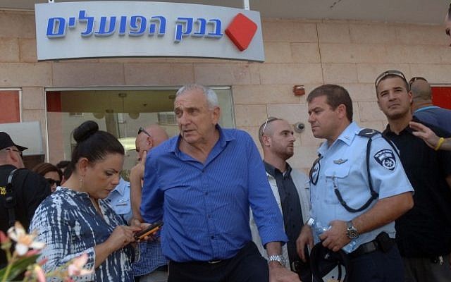 Minister of Public Security Yitzhak Aharonovitch speaks to the media at the Beersheba bank where a local gunman shot and killed four people in May. (photo credit: Dudu Greenspan/Flash90)