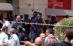 The crime scene outside the Bank Hapoalim in Beersheba where four people were killed by a local gunman on May 20, 2013. (photo credit: Dudu Greenspan/Flash90)