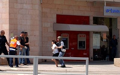 Miri Cohen, a bank employee, was released after being held hostage for over an hour Monday in Beersheba by a gunman who killed four victims at a local bank (photo credit: Dudu Greenspan/Flash 90)