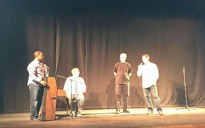 The four comedians of Comedy for Koby: Ralph Harris, Wayne Federman (seated), Dennis Regan and Avi Liberman (photo credit: Jessica Steinberg/Times of Israel)