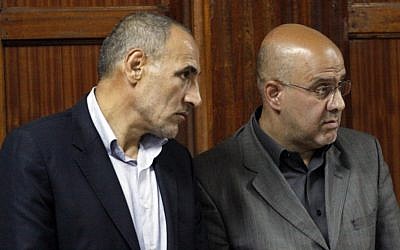 Iranian nationals Sayed Mansour Mousavi and Ahmad Abolfathi Mohammad await judgment at the magistrate's court in Nairobi, Kenya, on Monday. (photo credit: AP/Khalil Senosi)