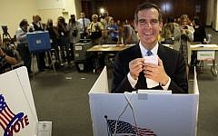Los Angeles Mayoral candidate Eric Garcetti votes early Tuesday morning, May 21, 2013, in Los Angeles. (photo credit: AP Photo/Damian Dovarganes)