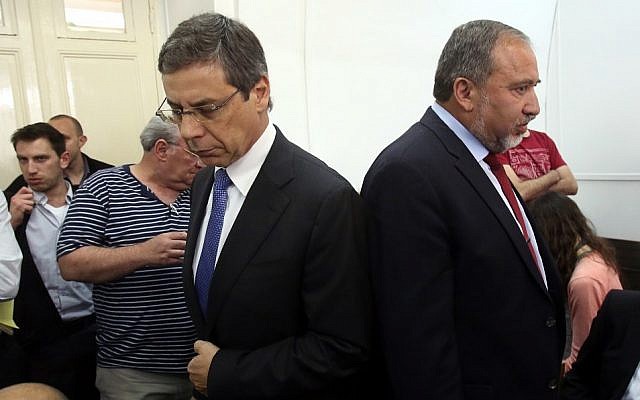 Danny Ayalon (right) and Avigdor Liberman in court in 2013. The two men, once close allies, did not speak (Yossi Zamir/POOL/Flash90) Danny Ayalon (right) and Avigdor Liberman in court in 2013. The two men, once close allies, did not speak (Yossi Zamir/POOL/Flash90)
