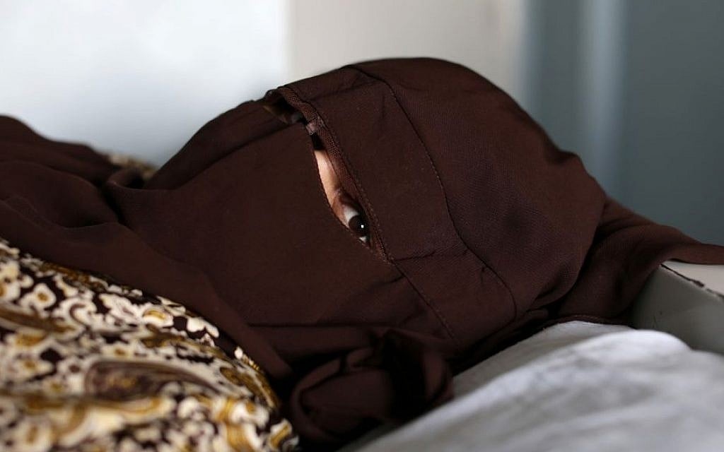 Azza William, who gave herself the name Habibah Shaaban after she converted to Islam, speaks to the Associated Press while recovering at Assiut University's Teaching Hospital, some 180 miles (300 kilometers) south of Cairo, earlier this month. (photo credit: AP/Hassan Ammar) Azza William, who gave herself the name Habibah Shaaban after she converted to Islam, speaks to the Associated Press while recovering at Assiut University's Teaching Hospital, some 180 miles (300 kilometers) south of Cairo, earlier this month. (photo credit: AP/Hassan Ammar)