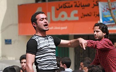 This April 1, 2011 photo shows activist Ahmed Douma chanting slogans during a march to Tahrir Square demanding prosecution of members of former Egyptian president Hosni Mubarak's regime in Cairo, Egypt. (AP Photo/Sarah Carr)