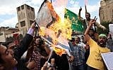Egyptian men chant anti-Israeli slogans during a Muslim Brotherhood-staged anti-Israel rally in Cairo on May 11, 2013. (photo credit: Khalil Hamra/AP)