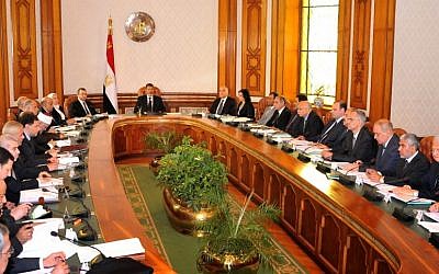 Mohammed Morsi, center, meets with his cabinet in Cairo, Egypt, Tuesday, May 7 (photo credit: AP /Egyptian Presidency)