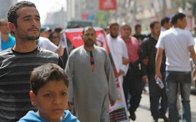 Activist Ahmed Douma, left, marching to Tahrir Square to demand prosecution of members of former president Hosni Mubarak's regime in Cairo, Egypt, April 1, 2011. (photo credit: AP/Sarah Carr) Activist Ahmed Douma, left, marching to Tahrir Square to demand prosecution of members of former president Hosni Mubarak's regime in Cairo, Egypt, April 1, 2011. (photo credit: AP/Sarah Carr)