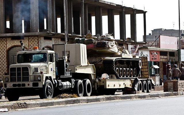 An Egyptian Army vehicle with a tank heads to the closed Rafah border crossing between Egypt and the Gaza strip, in Sheikh Zuweyid, northern Sinai, Egypt, Monday, May 20, 2013 (AP Photo/Roger Anis, El Shorouk Newspaper) An Egyptian Army vehicle with a tank heads to the closed Rafah border crossing between Egypt and the Gaza strip, in Sheikh Zuweyid, northern Sinai, Egypt, Monday, May 20, 2013 (AP Photo/Roger Anis, El Shorouk Newspaper)