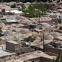 A general view of rooftops in an old district of the eastern city of Birjand, Iran. When struggling families in the eastern Iranian city of Birjand take measure of Mahmoud Ahmadinejad's presidency in its waning weeks, it's not about his browbeating oratory against the West or his battles with Iran's ruling clerics. Instead, it's the rows of simple two-story homes on the city's outskirts that sharply improved their lives. (photo credit: AP/Vahid Salemi)