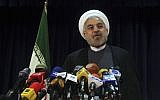 Former Iranian nuclear negotiator Hasan Rowhani speaks with media after registering his candidacy for upcoming presidential election (photo credit: AP Photo/Ebrahim Noroozi)