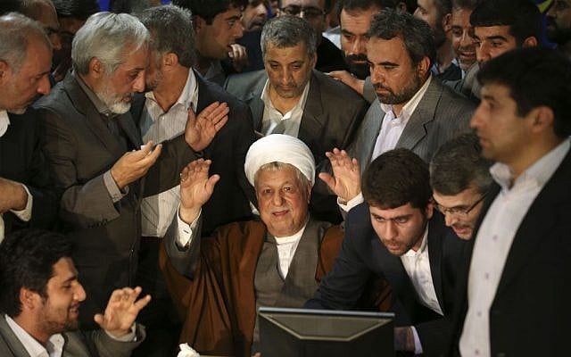Former Iranian President Akbar Hashemi Rafsanjani, 78, waves to media, as he registers his candidacy for the upcoming presidential election earlier this month. (photo credit: AP/Ebrahim Noroozi) Former Iranian President Akbar Hashemi Rafsanjani, 78, waves to media, as he registers his candidacy for the upcoming presidential election earlier this month. (photo credit: AP/Ebrahim Noroozi)