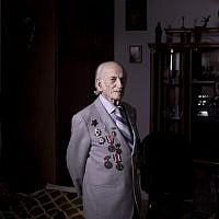 Soviet Jewish World War Two veteran Semion Tzvang 89, Friday, April 12, 2013. Tzvang joined the Red Army in 1941 and served in the First Ukrainian Front, a Soviet army group. He fought in Kiev, Prague and Berlin. (photo credit: AP/Oded Balilty)
