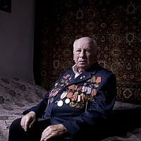 Soviet Jewish World War II veteran Matvey Gershman, 90, poses for a portrait at his house in the southern Israeli city of Ashkelon. Friday, April 12, 2013, (photo credit: AP/Oded Balilty)