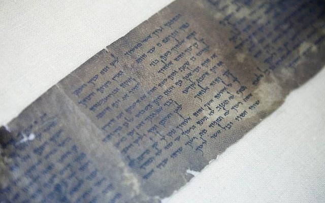 This photo shows the Ten Commandments written on one of the Dead Sea Scrolls in Jerusalem. (photo credit: AP/Dan Balilty) This photo shows the Ten Commandments written on one of the Dead Sea Scrolls in Jerusalem. (photo credit: AP/Dan Balilty)