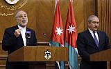 In this Tuesday, May 7, 2013 file photo, Iranian Foreign Minister Ali Akbar Salehi, left, speaks at a joint news conference as his Jordanian counterpart, Naser Judeh, listens in Amman, Jordan. Salehi wrote in an opinion piece in the Lebanese daily Al-Akhbar Wednesday, May 8, that it is up to the Syrian people to choose their political system and president, suggesting Tehran is not wedded to Assad's continued rule. (Photo credit: AP/Raad Adayleh)