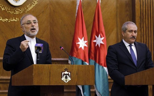 In this Tuesday, May 7, 2013 file photo, Iranian Foreign Minister Ali Akbar Salehi, left, speaks at a joint news conference as his Jordanian counterpart, Naser Judeh, listens in Amman, Jordan. Salehi wrote in an opinion piece in the Lebanese daily Al-Akhbar Wednesday, May 8, that it is up to the Syrian people to choose their political system and president, suggesting Tehran is not wedded to Assad's continued rule. (Photo credit: AP/Raad Adayleh) In this Tuesday, May 7, 2013 file photo, Iranian Foreign Minister Ali Akbar Salehi, left, speaks at a joint news conference as his Jordanian counterpart, Naser Judeh, listens in Amman, Jordan. Salehi wrote in an opinion piece in the Lebanese daily Al-Akhbar Wednesday, May 8, that it is up to the Syrian people to choose their political system and president, suggesting Tehran is not wedded to Assad's continued rule. (Photo credit: AP/Raad Adayleh)