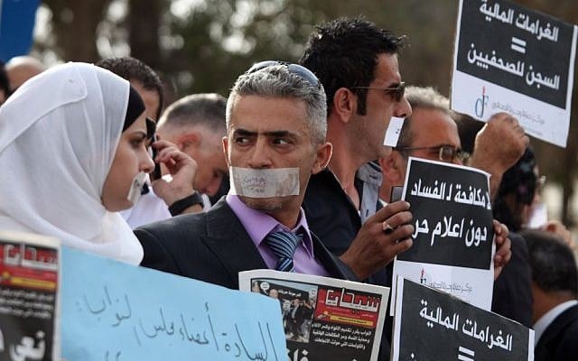 File: Jordanian journalists protest in front of the country's Parliament in Amman in 2011 over changes to the country's anti-corruption laws that they claimed muzzled press freedoms in the kingdom. (AP Photo/Mohammad Hannon)