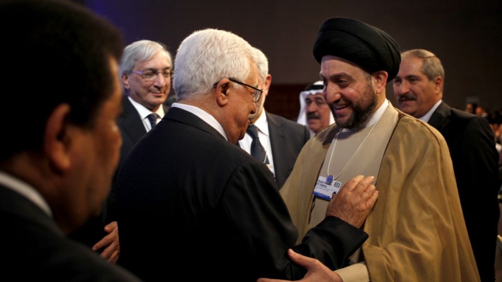 Palestinian Authority President Mahmoud Abbas, left, greets Ammar al-Hakim, head of the Supreme Islamic Council of Iraq, at the World Economic Forum in Jordan on Saturday. (photo credit: AP Photo/Mohammad Hannon)