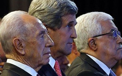 US Secretary of State John Kerry, Israeli President Shimon Peres, left, and Palestinian President Mahmoud Abbas, right, participate in the World Economic Forum on the Middle East and North Africa at the King Hussein Convention Center at the Dead Sea in Jordan Sunday May 26, 2013. (photo credit: AP/ Jim Young)
