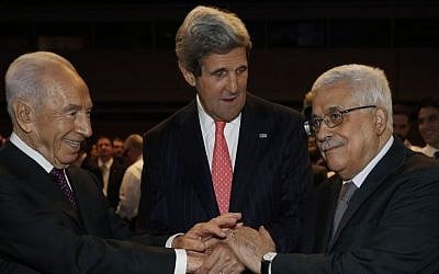 US Secretary of State John Kerry (center), Israeli President Shimon Peres (left), and Palestinian Authority President Mahmoud Abbas shake hands during the World Economic Forum in Jordan, Sunday May 26, 2013. (photo credit: AP/Jim Young)