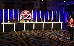 A Palestinian contestant stands in front of the judges during a taping of the program "The President" in the West Bank city of Bethlehem. The show offers contestants a chance to address the Palestinian people on what they would do on a variety of subjects if elected president. (photo credit: AP/Majdi Mohammed)