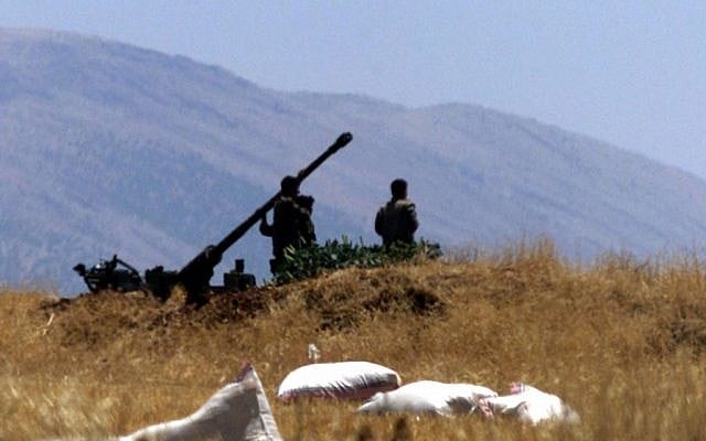 Illustrative photo of Syrian soldiers preparing an anti-aircraft gun, 2001. (photo credit: AP/File)