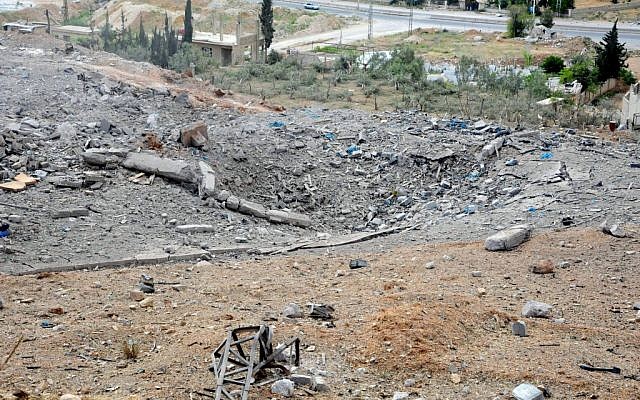 This photo released by the Syrian official news agency SANA, shows a general view of damaged buildings wrecked by an Israeli airstrike, in Damascus, Syria, Sunday, May 5, 2013. (Photo credit: AP/SANA) This photo released by the Syrian official news agency SANA, shows a general view of damaged buildings wrecked by an Israeli airstrike, in Damascus, Syria, Sunday, May 5, 2013. (Photo credit: AP/SANA)