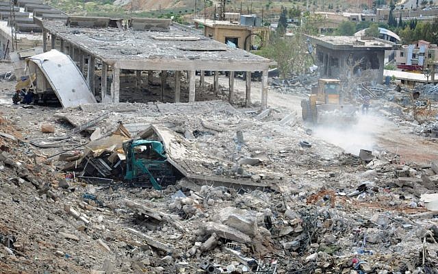 Illustrative image released by the Syrian official news agency SANA shows a general view of damaged buildings wrecked by an Israeli airstrike, in Damascus, Syria, Sunday, May 5, 2013. (AP/SANA) Illustrative image released by the Syrian official news agency SANA shows a general view of damaged buildings wrecked by an Israeli airstrike, in Damascus, Syria, Sunday, May 5, 2013. (AP/SANA)