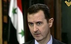 Syrian President Bashar Assad during an interview broadcast on al-Manar television on Thursday, May 30, 2013. (photo credit: AP/al-Manar television)