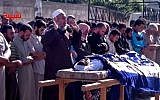 Syrians participate in the funeral prayer for Youssef Ghazi al-Sarmani who was killed in fighting between rebel and government forces, Monday, May 27, 2013 (photo credit: AP/Shaam News Network)