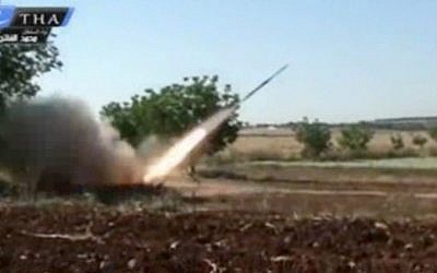 A rocket fired by Syrian rebels in Qusair, Syria, May 28 (photo credit: Ugarit news/AP)