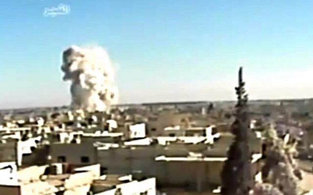 This image made from video shows an explosion from shelling in Qusair, Syria, in late May (photo credit: AP/Ugarit News) This image made from video shows an explosion from shelling in Qusair, Syria, in late May (photo credit: AP/Ugarit News)