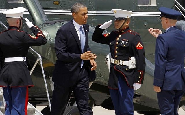 Air Force Col. Bill Knight, right, greets Barack Obama at Andrews Air Force Base on Monday before Obama boarded Air Force One to New York City for private fundraisers. (photo credit: AP/Ann Heisenfelt) Air Force Col. Bill Knight, right, greets Barack Obama at Andrews Air Force Base on Monday before Obama boarded Air Force One to New York City for private fundraisers. (photo credit: AP/Ann Heisenfelt)