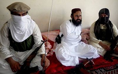 Taliban No 2 commander Waliur Rehman, center, talks to the Associated Press during an interview in Shawal area of South Waziristan along the Afghanistan border in Pakistan, in July 2011. (photo credit: AP Photo/Ishtiaq Mahsud, File)