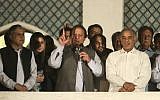 Former prime minister and leader of the Pakistan Muslim League-N party Nawaz Sharif, center, addresses his supporters as his brother Shahbaz Sharif, right, and daughter Maryam Nawaz, second from left, listen at a party office in Lahore, Pakistan, Saturday, May 11, 2013 (photo credit: AP/K.M. Chaudary)
