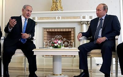 Russian President Vladimir Putin, right, listens to Israeli Prime Minister Benjamin Netanyahu during their meeting at the Bocharov Ruchei residence in the Black Sea resort of Sochi, Russia, Tuesday, May 14, 2013. (photo credit: AP/ Maxim Shipenkov)