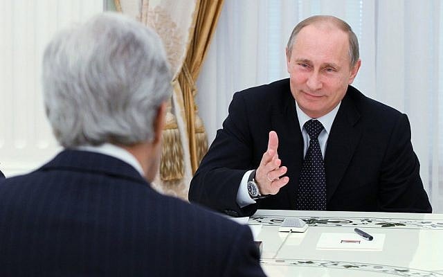 US Secretary of State John Kerry (back to camera) speaks to Russian President Vladimir Putin during their meeting in the Kremlin in Moscow, Tuesday, May 7, 2013. (photo credit: AP) US Secretary of State John Kerry (back to camera) speaks to Russian President Vladimir Putin during their meeting in the Kremlin in Moscow, Tuesday, May 7, 2013. (photo credit: AP)