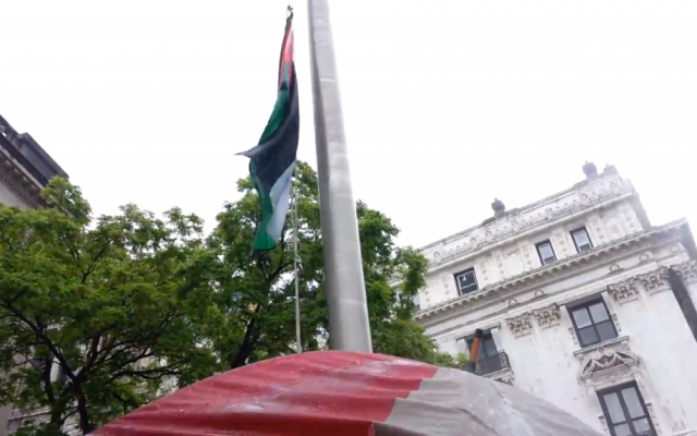 Palestinian-Americans run up the Palestinian flag at Paterson, NJ City Hall on May 20, 2013. (photo credit: image capture from YouTube video uploaded by westbank04)